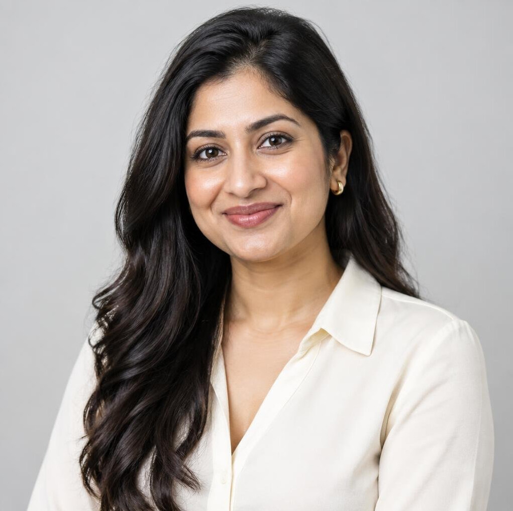 Studio portrait of a South Asian woman with long dark hair